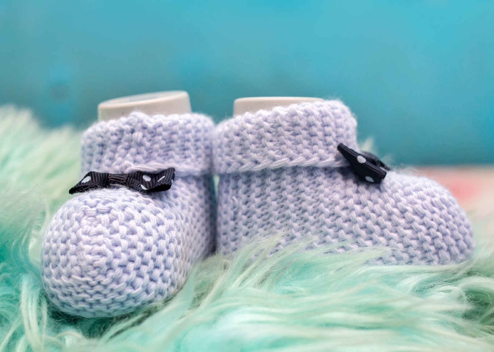 A pair of knitted baby booties